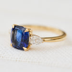 sri lankan blue sapphire trilogy engagement ring in gold