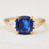 sri lankan blue sapphire trilogy engagement ring in yellow gold