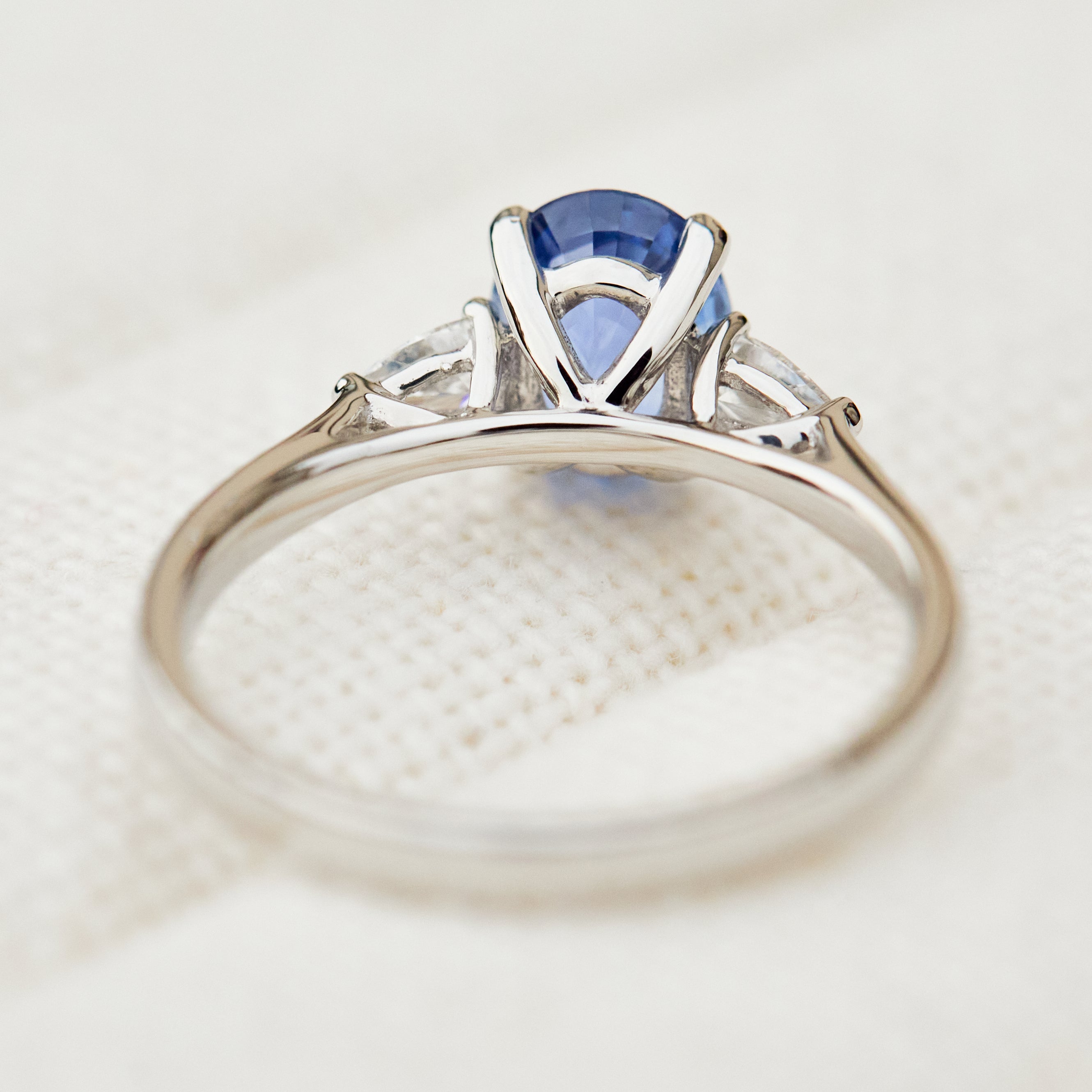 oval sri lankan blue sapphire trilogy platinum engagement ring