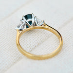 teal blue oval sapphire yellow gold and platinum engagement ring