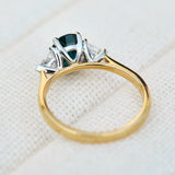 teal blue oval sapphire yellow gold and platinum engagement ring