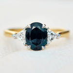 teal blue oval sapphire yellow gold and platinum engagement ring
