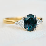 teal blue oval sapphire yellow gold and platinum engagement ring