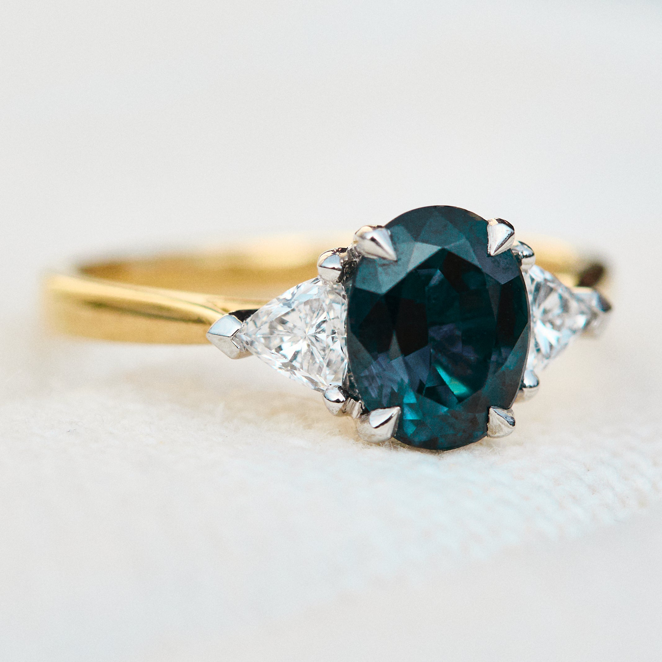 teal blue oval sapphire yellow gold and platinum engagement ring