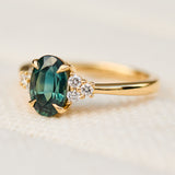 oval teal green sapphire and diamonds gold engagement ring