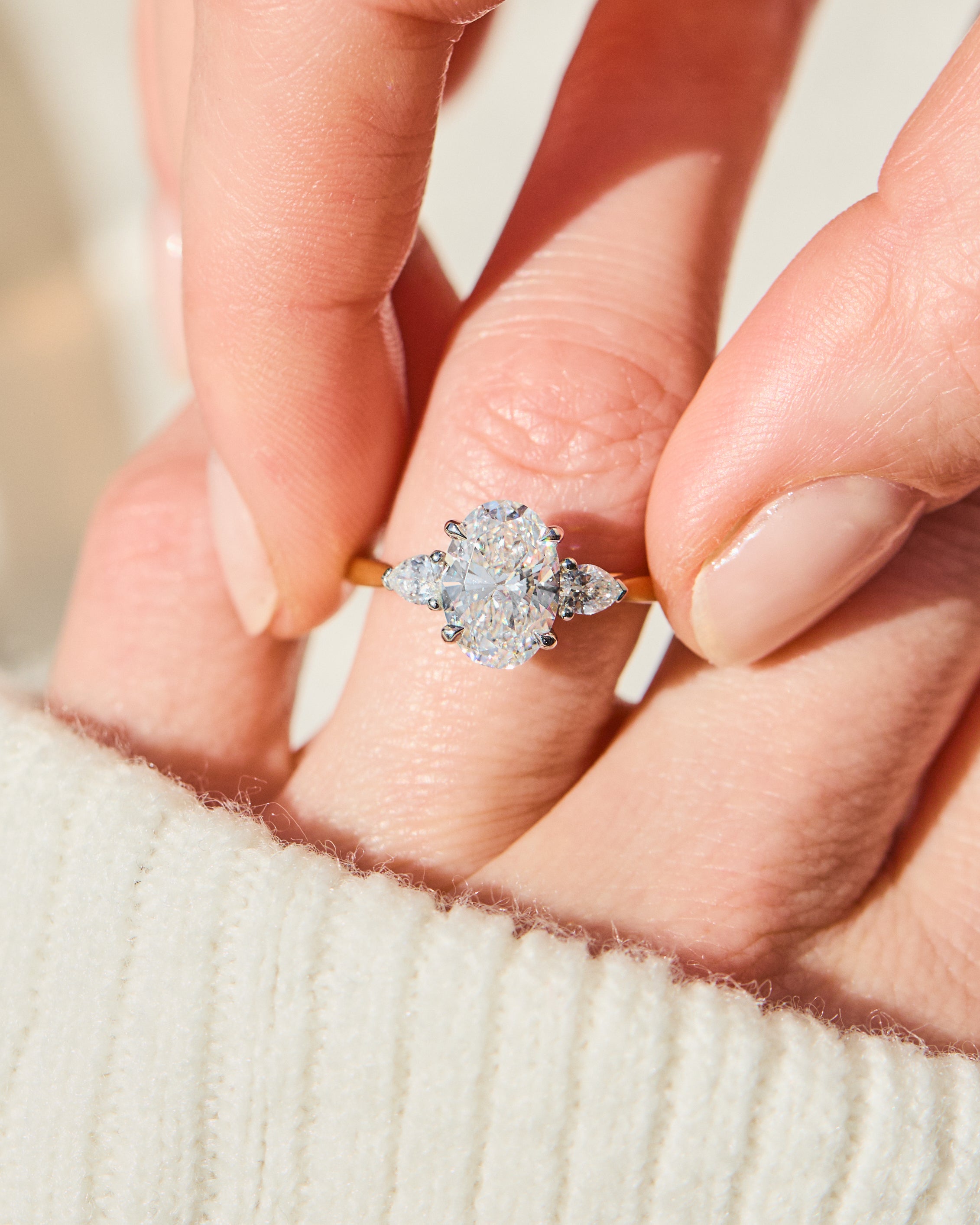 oval lab grown diamond yellow gold and platinum engagement ring