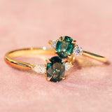 trilogy yellow gold rings with teal sapphires
