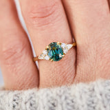 oval unheated green teal sapphire engagement ring in yellow gold