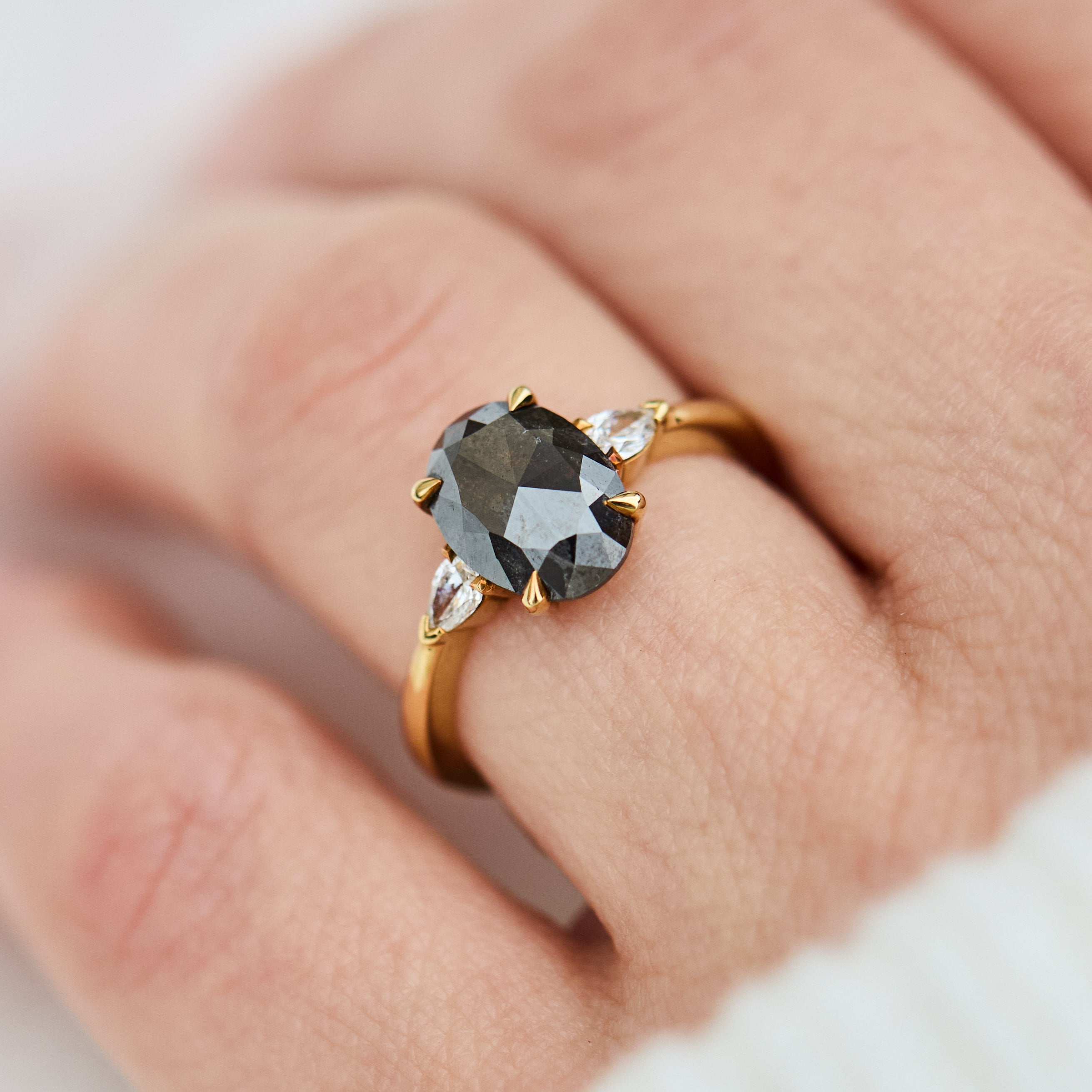 18ct yellow gold salt and pepper oval diamond engagement trilogy ring