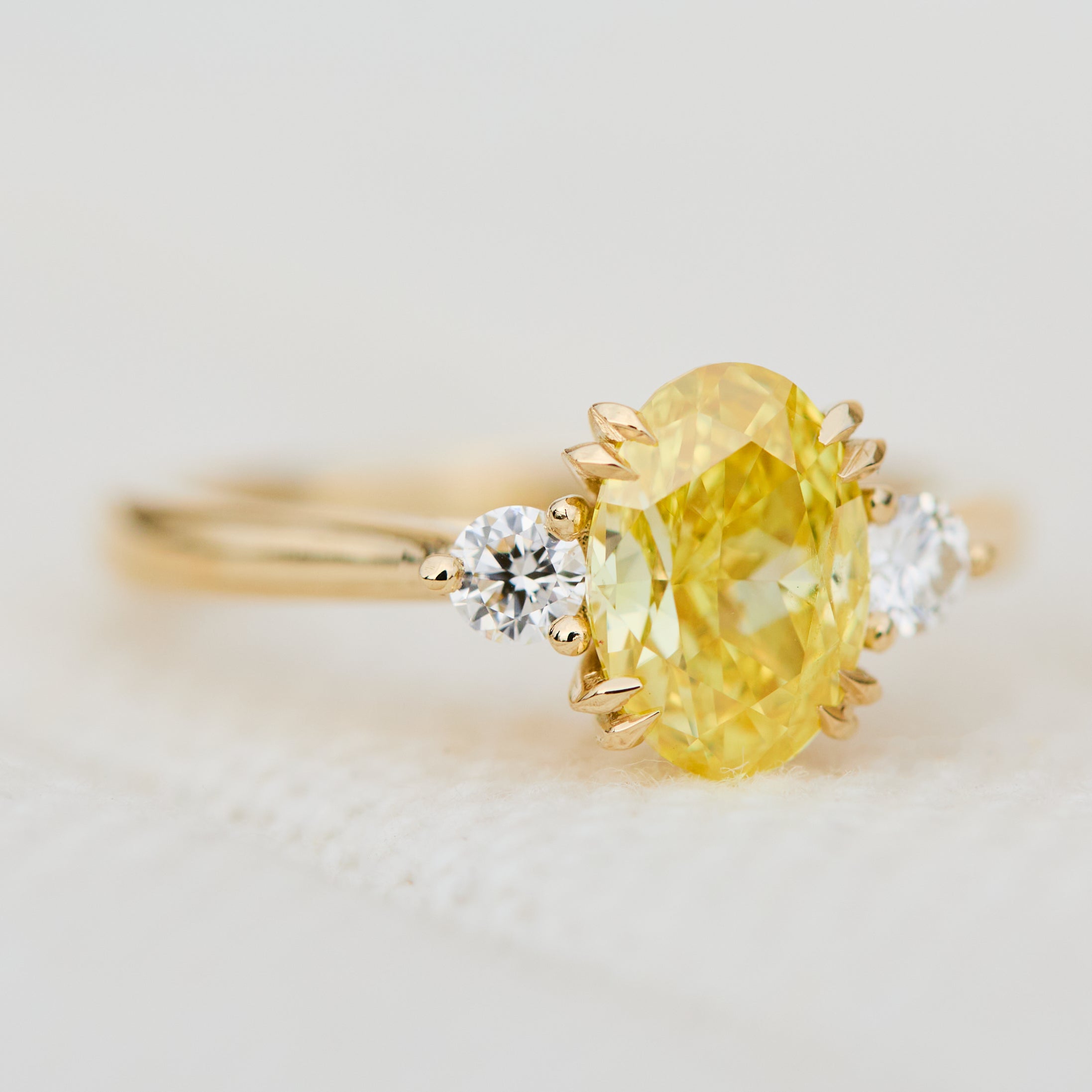 yellow gold yellow lab grown oval diamond trilogy engagement ring