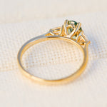 oval green sapphire engagement ring yellow gold