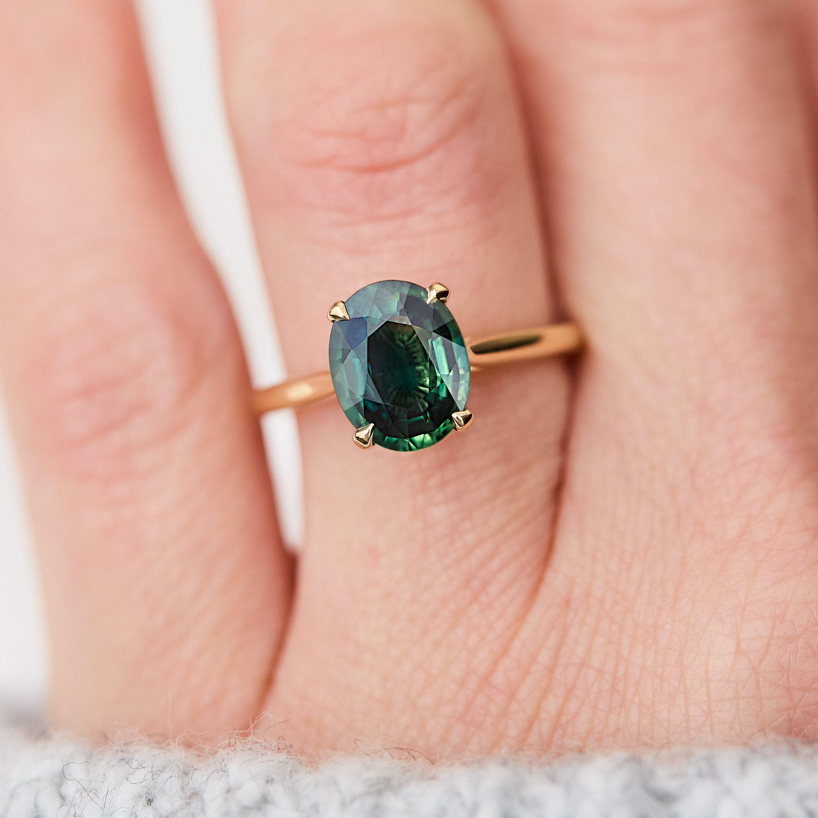 oval teal sapphire solitaire ring
