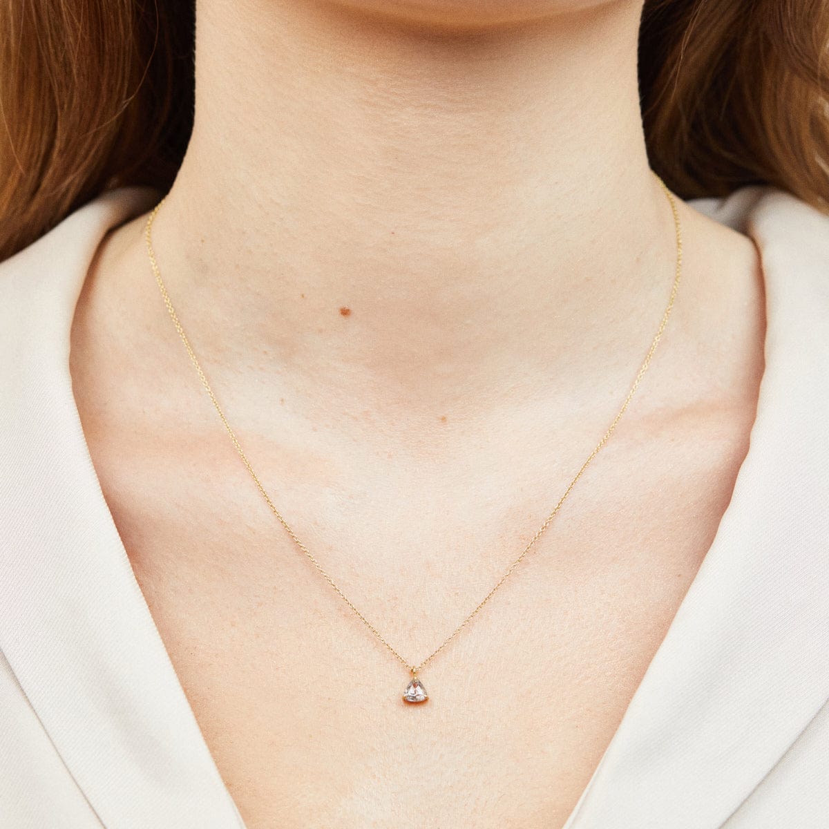 Rose-cut triangular salt and pepper diamond necklace in 18ct yellow gold.