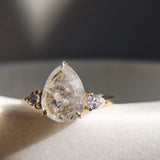 18ct yellow gold salt and pepper pear diamond engagement trilogy ring