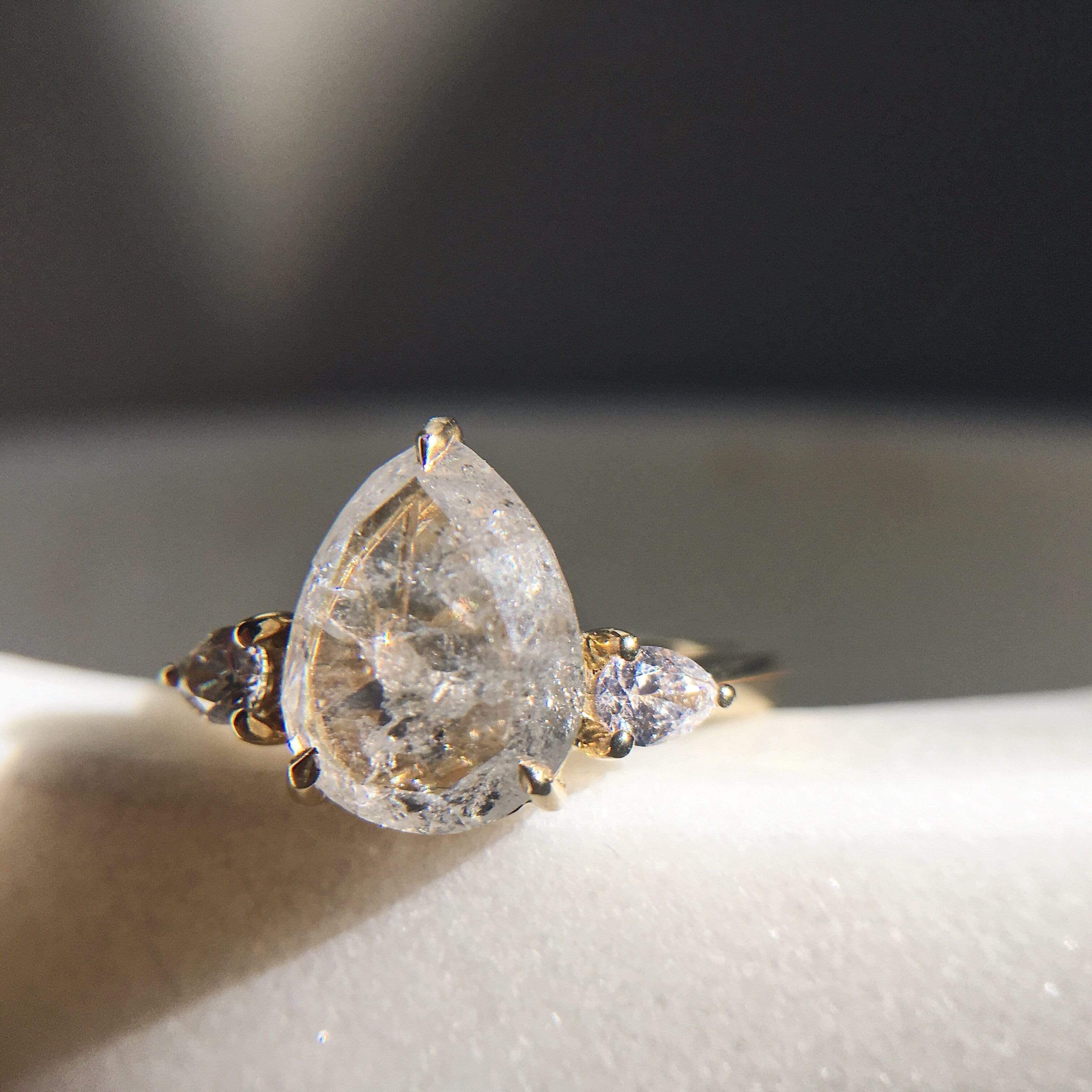 18ct yellow gold salt and pepper pear diamond engagement trilogy ring