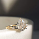 18ct yellow gold salt and pepper pear diamond engagement trilogy ring