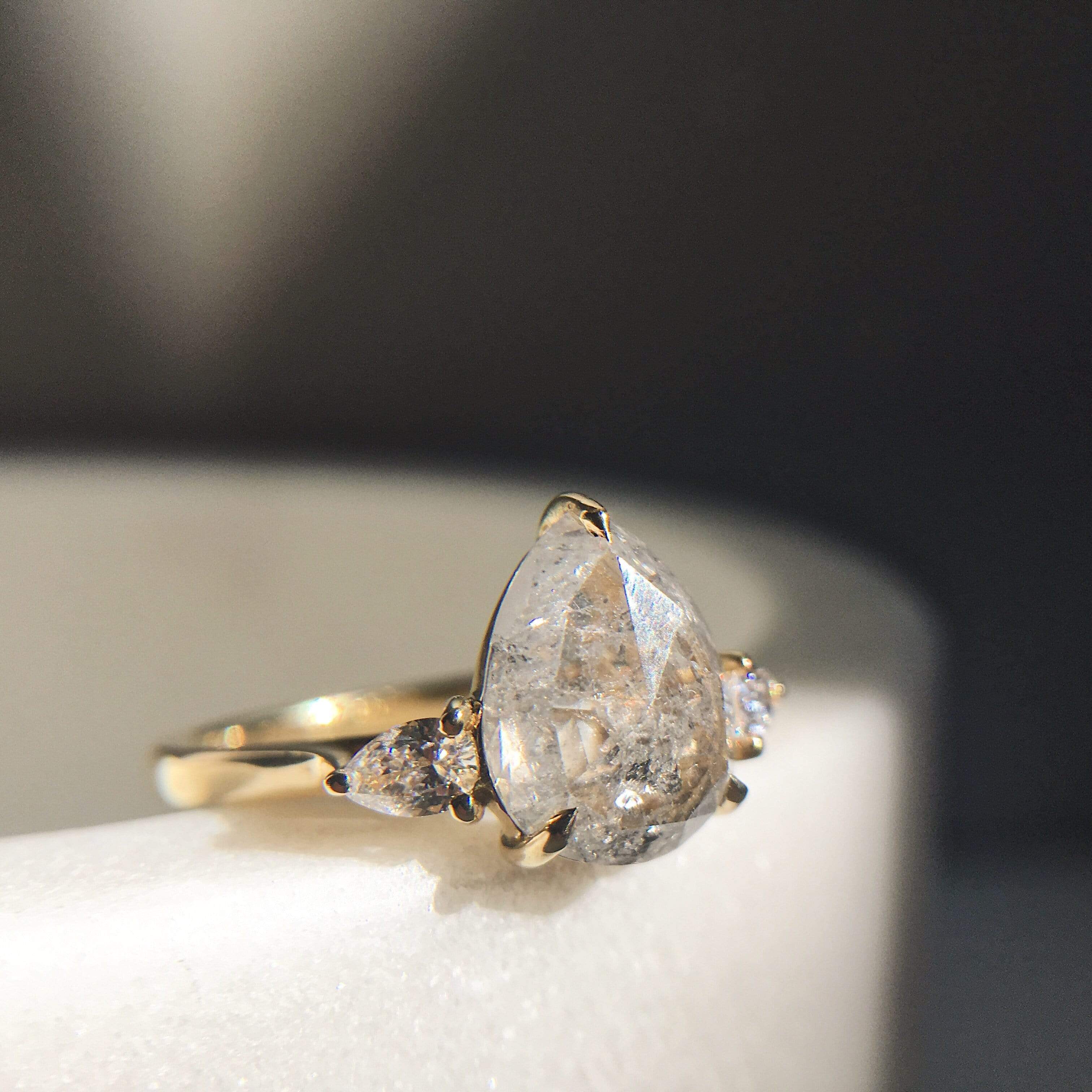 18ct yellow gold salt and pepper pear diamond engagement trilogy ring