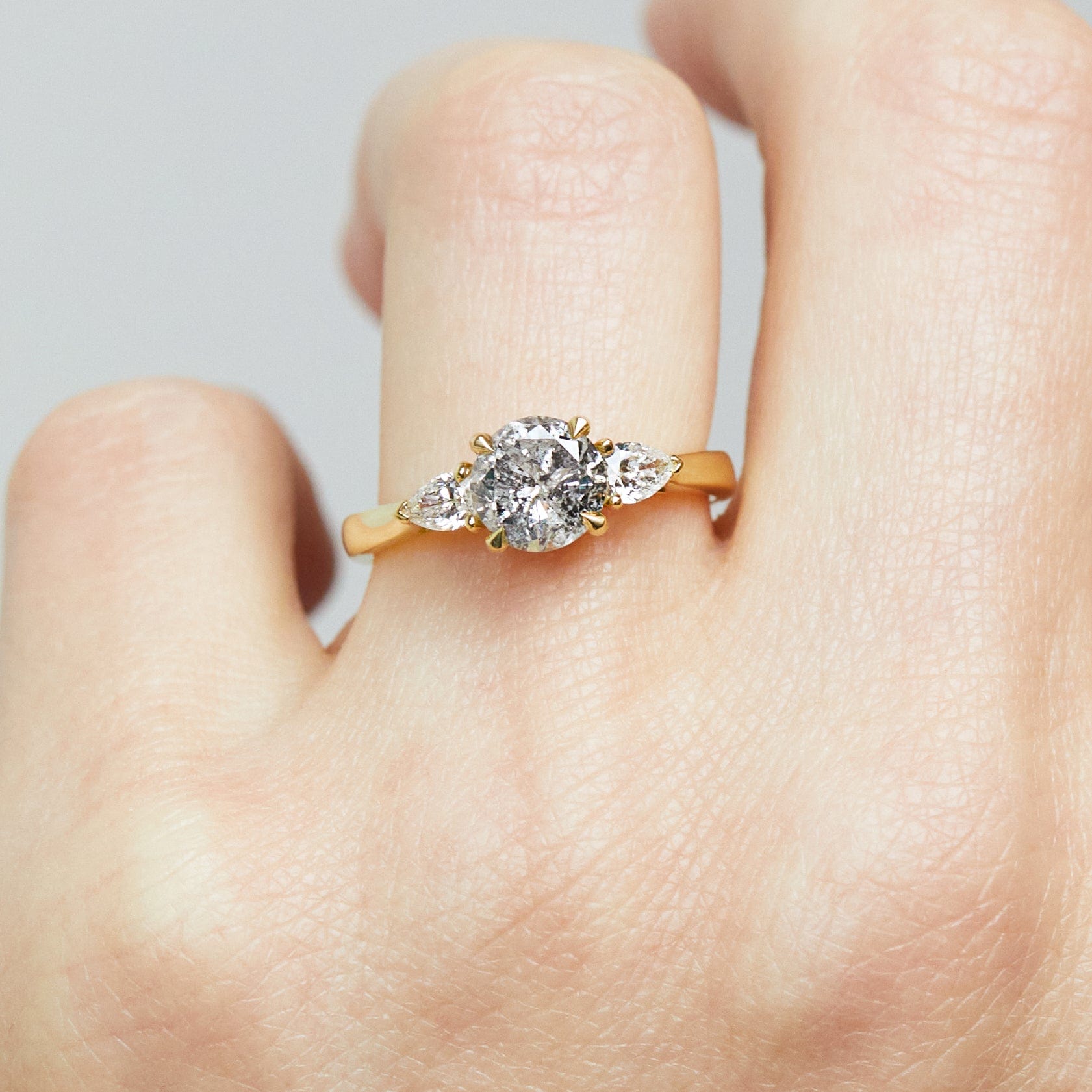 18ct yellow gold salt and pepper round brilliant cut diamond engagement trilogy ring