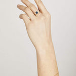 Blue sapphire evil eye bracelet with diamonds in 18ct yellow gold.