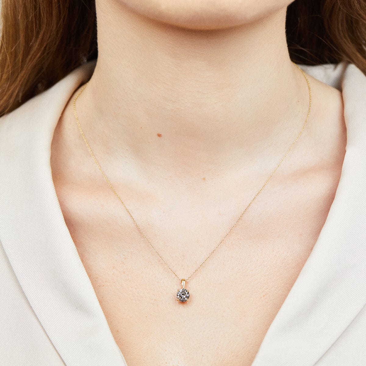 Dark salt and pepper diamond necklace in 18ct yellow gold with a 16-inch chain.