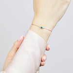 Green sapphire evil eye bracelet with diamonds in 18ct white gold.