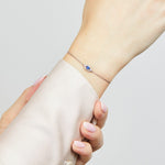 Sapphire evil eye bracelet with diamonds in 18ct white gold.