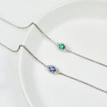 Sapphire evil eye bracelet with diamonds in 18ct white gold.