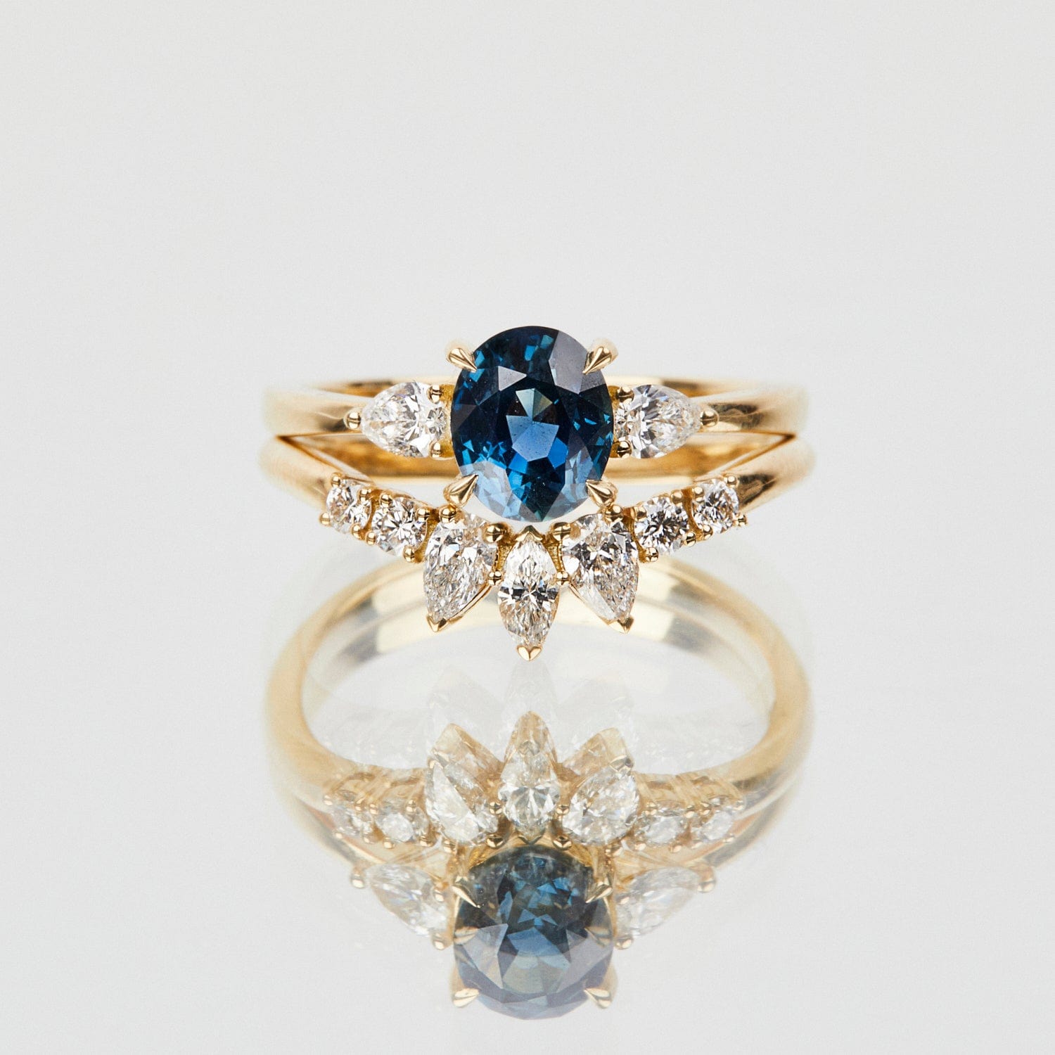 18ct yellow gold oval trilogy ​teal sapphire rings