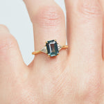 18ct yellow gold emerald cut trilogy ​teal sapphire rings