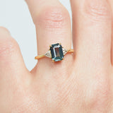 18ct yellow gold emerald cut trilogy ​teal sapphire rings