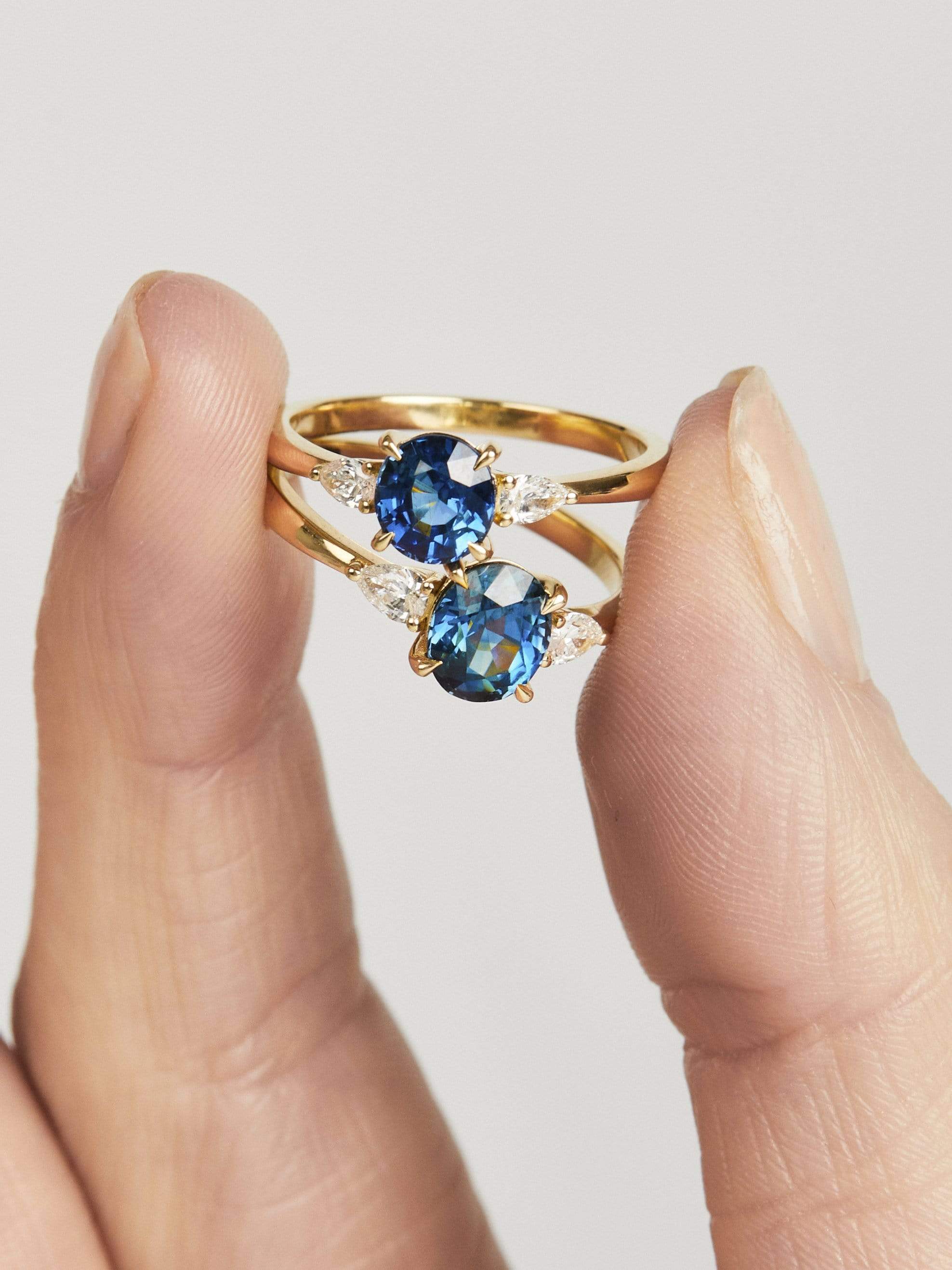 18ct yellow gold oval trilogy ​teal sapphire rings
