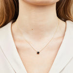 Black cushion cut diamond necklace in 18ct yellow gold.