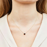 Black cushion cut diamond necklace in 18ct yellow gold.